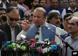 Nawaz Sharif addresses a crowd during his visit to a mausoleum of Pakistani poet Mohammad Iqbal on the occasion of Pakistan Independence Day in Lahore, Aug. 14, 2017.
