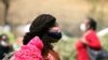 A woman wears a face mask as protection against COVID-19 in Abuja, Nigeria, Feb. 2, 2021.