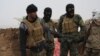 On the front lines in the western countryside, Hashd Shaabi soldiers say Islamic State militants continue to attack with car bombs, in Nineveh province, Iraq, on Dec. 15, 2016.