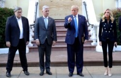 FILE - U.S. President Donald Trump stands in front of St. John's Episcopal Church across from the White House with U.S. Attorney General Bill Barr, National Security Advisor Robert O'Brien and White House Press Secretary Kayleigh McEnany.