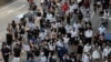 Protesters march during a flash mob protest in Hong Kong, on Friday, Oct. 11, 2019. Hundreds of masked protesters gathered at Chater Garden in central Hong Kong on Friday to rally against police brutality and show their support for students who have…