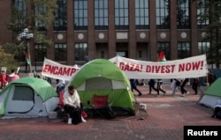 FILE - Students rally on the University of Michigan college campus in Ann Arbor, Michigan, U.S., April 22, 2024. (REUTERS/Rebecca Cook)