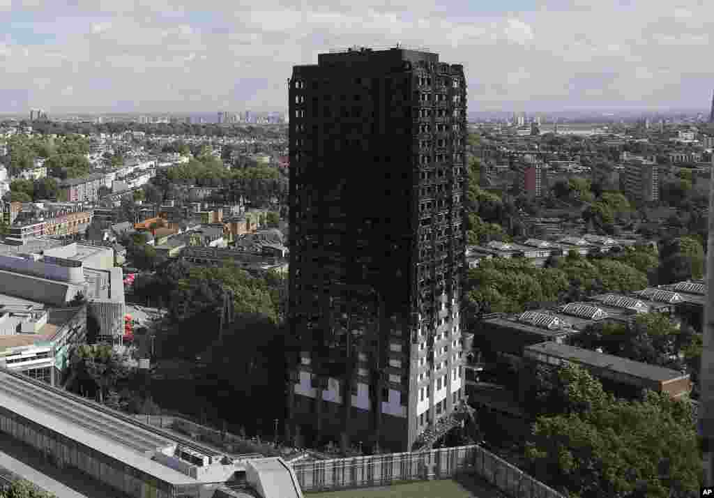 The scorched facade of the Grenfell Tower in London, after a massive fire raced through the 24-story high-rise apartment building in west London early Wednesday.