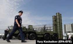 RUSSIA -- A Russian military official walks in front of The S-400 Triumph anti-aircraft missile system during the Army 2017 International Military Technical Forum in Patriot Park outside Moscow, August 22, 2017