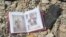 An family photo album lies among debris and blood where civilians were shot down by Islamic State snipers in early June, in Mosul, Iraq, June 15, 2017.