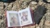 An family photo album lies among debris and blood where civilians were shot down by Islamic State snipers in early June, in Mosul, Iraq, June 15, 2017.