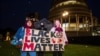 New Zealand protesters hold a vigil against the killing of Minneapolis man George Floyd in a Black Lives Matter protest outside Parliament in Wellington, June 1, 2020. 
