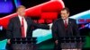 Donald Trump, left, jokes with Ted Cruz during the CNN Republican presidential debate at the Venetian Hotel & Casino on Tuesday, Dec. 15, 2015.