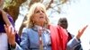 US first Lady Jill Biden, left, greets women of the Maasai community as they explain the drought situation in Ngatataek, Kajiado Central, Kenya, Feb. 26, 2023. 