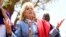 US first Lady Jill Biden, left, greets women of the Maasai community as they explain the drought situation in Ngatataek, Kajiado Central, Kenya, Feb. 26, 2023. 