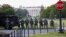 Law enforcement officers from Calvert County Maryland Sheriff's Office standing on the Ellipse, area just south of the White House in Washington, as they watch demonstrators protest