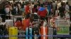 Passengers wait at airline counters at Hong Kong's international airport, Sept. 23, 2013.