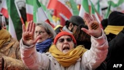 Supporters of the People's Mujahedin of Iran People show their hands with stickers reading "Our choice, Maryam Rajavi" during a demonstration called by members of the Iran opposition to call for justice, human rights and freedom for the Iranian people in Paris, Feb. 8, 2025.