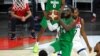 FILE - Nigeria's Ike Nwamu (34) shoots against the United States during an exhibition basketball game in Las Vegas, July 10, 2021.