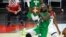 FILE - Nigeria's Ike Nwamu (34) shoots against the United States during an exhibition basketball game in Las Vegas, July 10, 2021.
