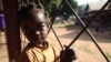 A girl waits at Bossangoa hospital, where medics are treating a high number of children for malaria, malnutrition, anaemia and violence-related injuries inlcuding gunshot wounds, Nov. 9, 2013. (Hanna McNeish for VOA.)