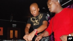 One of the originators of kwaito music, Mahoota (left) with South Africa’s DJ Vetkuk, spinning the vibes at a club in Johannesburg