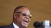 FILE - Former Malawian President Peter Mutharika addresses guests during his inauguration in Blantyre, May 31, 2019. His bodyguard, Norman Chisale, was arrested July 17, 2020, for the second time in a week. 