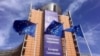 European Union flags flap in the wind outside EU headquarters in Brussels, Wednesday, April 10, 2019. European Union leaders meet Wednesday in Brussels for an emergency summit to discuss a new Brexit extension. (AP Photo/Virginia Mayo)