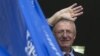 FILE - Serbian nationalist leader Vojislav Seselj waves to his supporters from a balcony of his Serbian Radical Party headquarters in Belgrade, Serbia, Nov. 12, 2014