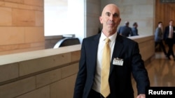 FILE - State Department Inspector General Steve Linick leaves a meeting in Washington, D.C., Oct. 2, 2019.