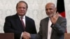 Afghan President Ashraf Ghani (R) shakes hands with Pakistani Prime Minister Nawaz Sharif after a news conference in Kabul, May 12, 2015. 