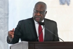 FILE - US Supreme Court Justice Clarence Thomas delivers a keynote speech during a dedication the Nathan Deal Judicial Center in Atlanta, Georgia, Feb. 11, 2020.