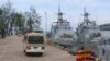 FILE - Buses carrying journalists drive on the jetty mooring warships during a rare media tour of Cambodia’s Ream Naval Base, in Sihanoukville, Cambodia, Friday, July 26, 2019. (Sophat Soeung/VOA Khmer)