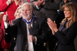 FILE - Conservative radio talk show host Rush Limbaugh reacts as he is awarded the Presidential Medal of Freedom by U.S. first lady Melania Trump during U.S. President Donald Trump's State of the Union address at the U.S. Capitol, Feb. 4, 2020.