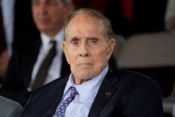 FILE - Former Senate Majority Leader Bob Dole attends a ceremony at Joint Base Myer-Henderson Hall, Virginia, Sept. 30, 2019.