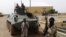 Fighters from the Al Qaeda-linked Islamist group MUJWA stand guard in Gao, northern Mali, August 7, 2012.