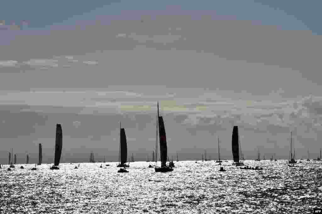 Imoca monohulls sail off the coast to take the start of the Vendee Globe solo around-the-world sailing race in Les Sables-d&#39;Olonne, western France.