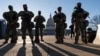 National Guard troops and members of the U.S. Capitol Police keep watch as security remains high on Capitol grounds following the Jan. 6 attack by supporters of then-President Donald Trump, in Washington, March 3, 2021.