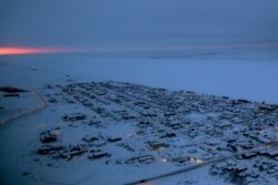 In this Feb. 15, 2019, photo, the sun rises in the horizon at the start of the day in Nome, Alaska. (AP Photo/Wong Maye-E)