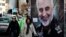 Women walk past a banner of Iranian Revolutionary Guard Corps Gen. Qassem Soleimani, who was killed in Iraq in a U.S. drone attack Friday, in Tajrish Square in northern Tehran, Iran, Jan. 9, 2020.