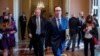 Treasury Secretary Steven Mnuchin, right, accompanied by White House chief of staff Mark Meadows, left, leave a meeting with Senate Majority Leader Mitch McConnell as negotiations continue on a coronavirus relief package on Capitol Hill, Aug. 4, 2020.