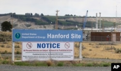 FILE - In this July 9, 2014, photo, a sign informs visitors of prohibited items on the Hanford Nuclear Reservation near Richland, Washington. An emergency has been declared May 9, 2017, at the Hanford Nuclear Reservation.