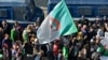 Des Algériens défilent dans une manifestation antigouvernementale dans la capitale Alger le 14 février 2020. (Photo by RYAD KRAMDI / AFP)