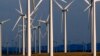 FILE - A wind turbine farm owned by PacifiCorp near Glenrock, Wyoming, cranks out electricity, May 6, 2013.