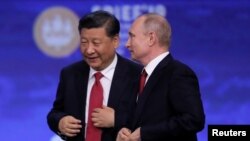 中国国家主席习近平和俄罗斯总统普京在圣彼得堡出席国际经济论坛会议期间。（2019年6月7日）