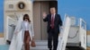 U.S. President Donald Trump, right, waves as he and first lady Melania Trump arrive at the airport in Helsinki, Finland, July 15, 2018, on the eve of his meeting with Russian President Vladimir Putin.
