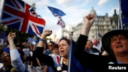 Anti-Brexit protesters demonstrate outside the Houses of Parliament in London, Sept. 4, 2019.