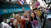 Anti-government protesters cheer during a march through Bangkok, Thailand, Feb. 3, 2014. 