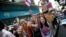 Anti-government protesters cheer during a march through Bangkok, Thailand, Feb. 3, 2014. 