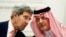 U.S. Secretary of State John Kerry (l) speaks with Saudi Arabia's Foreign Minister Prince Saud al-Faisal, in Riyadh, Nov. 4, 2013.