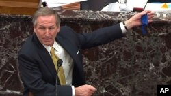 In this image from video, Michael van der Veen, an attorney for former President Donald Trump, answers a question from Sen. Bill Cassidy, R-La., during the second impeachment trial of former President Donald Trump.