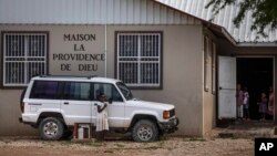 Children stand in the courtyard of the Maison La Providence de Dieu orphanage in Ganthier, Haiti, Sunday, Oct. 17, 2021, where a gang kidnapped 17 missionaries from a U.S.-based religious organization. (AP Photo/Joseph Odelyn)
