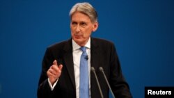 Britain's Chancellor of the Exchequer Philip Hammond speaks at the Conservative Party's conference in Manchester, Britain, Oct. 2, 2017.
