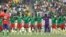 Cameroon players observe a minute of silent for the victims of the stampede, before the start of the African Cup of Nations 2022 quarter-final soccer match between Gambia and Cameroon at the Japoma Stadium in Douala, Cameroon, Jan. 29, 2022.