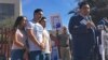 The family of Guadalupe Garcia de Rayos stands behind her attorney, Ray Ybarra Maldonado, as he speaks in front of the U.S. Immigration and Customs Enforcement office in Phoenix, Feb. 9, 2017.